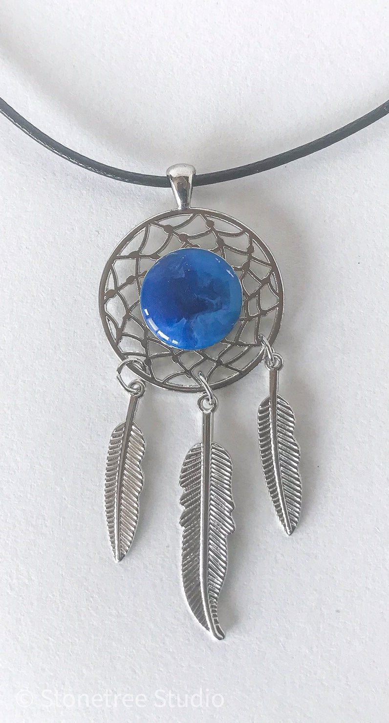 Silver dreamcatcher necklace with blue center