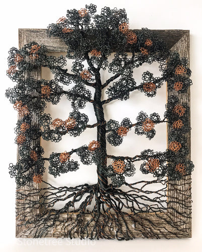 black and brown wire tree on wood frame